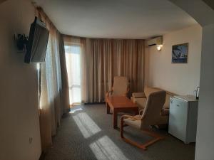 TV a/nebo společenská místnost v ubytování Hotel Orchidea