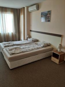 Postel nebo postele na pokoji v ubytování Hotel Orchidea