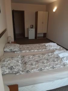 Postel nebo postele na pokoji v ubytování Hotel Orchidea