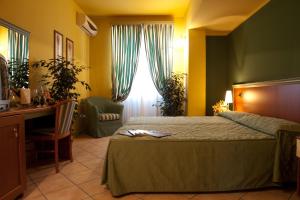 A bed or beds in a room at Villa Giglio