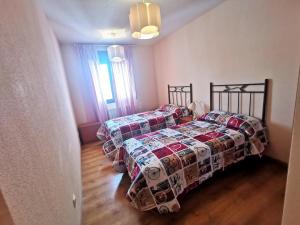 Postel nebo postele na pokoji v ubytování Riaza Vacacional - Apartamento en el centro
