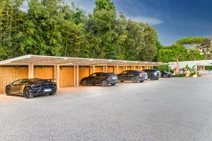 a group of cars parked in a garage at Resort Miramonti in Forte dei Marmi