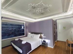 Cama ou camas em um quarto em Flag Design Hotel