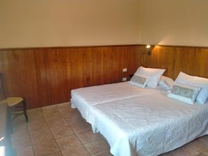 מיטה או מיטות בחדר ב-Casa Alberto