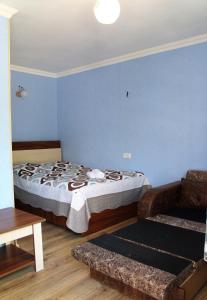 Postel nebo postele na pokoji v ubytování Lilia guesthouse