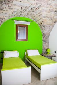 Postel nebo postele na pokoji v ubytování Appartamento Monte Misone