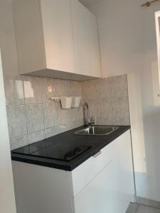 Kuchyňa alebo kuchynka v ubytovaní Apartments Villa Ohana