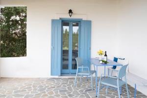 a blue table and chairs on a patio at Villa Stevi in Drios