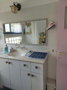 a bathroom with a sink and a mirror at Barud Gedera Israel in Gedera +86 photos