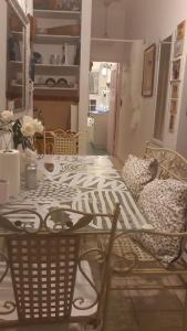 a table and chairs in a room with a table at Barud Gedera Israel in Gedera