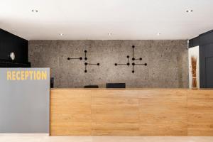 an office with a reception desk and a sign at Galaxy Hotel in Porto Heli