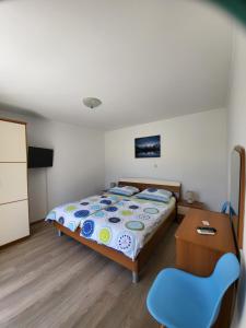 Postel nebo postele na pokoji v ubytování Apartmani Mira