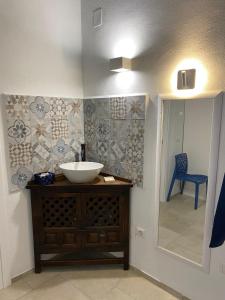 a bathroom with a sink and a mirror at Casale Montereale in Corato +33 photos
