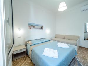 Postel nebo postele na pokoji v ubytování Torre del Salento