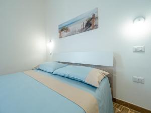 Postel nebo postele na pokoji v ubytování Torre del Salento