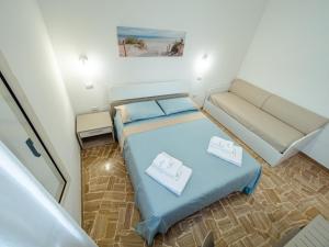 Postel nebo postele na pokoji v ubytování Torre del Salento