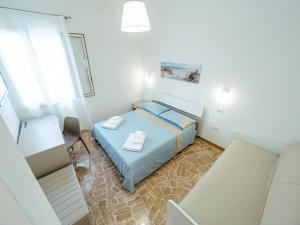Postel nebo postele na pokoji v ubytování Torre del Salento