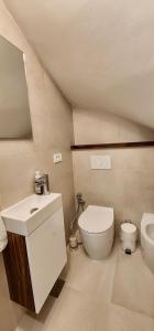 a small bathroom with a toilet and a sink at Comfort Studio Bella Lucia in Portorož