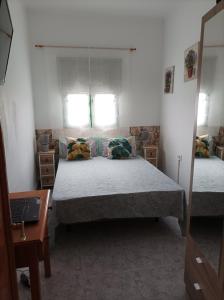 Posteľ alebo postele v izbe v ubytovaní Casa Antonia Reyes, a la sombra de Famara