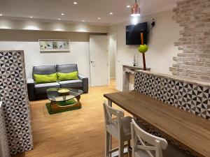 a living room with a couch and a table at Rentxacobeo in Sarria