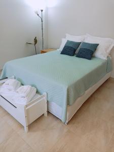 a bedroom with a large bed with blue sheets and pillows at New Stylish and Cozy Apartment in Kráni
