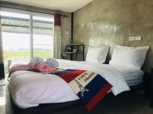 Postel nebo postele na pokoji v ubytování SolarCell Private Homestay - โซล่าเซลล์ไพรเวทโฮมสเตย์