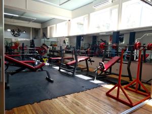 a gym with a bunch of equipment in a room at Апарт-отель Nine Rooms in Yerevan