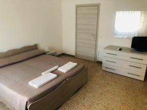 Postel nebo postele na pokoji v ubytování B&B dell'Amicizia