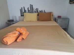 a bed with two towels on top of it at Evi in Xylokastro