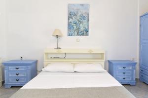 Ένα ή περισσότερα κρεβάτια σε δωμάτιο στο Palm Beach Hotel Ακτή Φοινηκα
