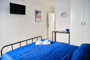 A bed or beds in a room at Mercede Rooms