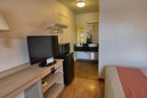 A television and/or entertainment centre at Motel 6-Coeur D'Alene, ID