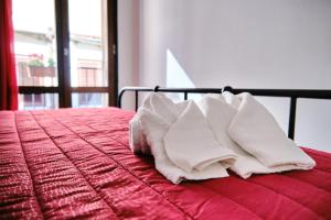 A bed or beds in a room at Mercede Rooms