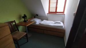 Posteľ alebo postele v izbe v ubytovaní Hotel Hospodářský dvůr Bohuslavice