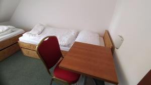 Posteľ alebo postele v izbe v ubytovaní Hotel Hospodářský dvůr Bohuslavice