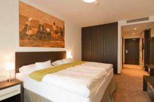 Voodi või voodid majutusasutuse Hotel Mousson toas