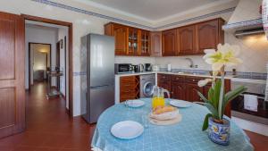 a kitchen with a table with a sandwich on it at Cozy Algarve Home with Vineyard View Near Beaches in Porches