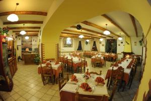a large dining room with tables and chairs at Rabbit in Agerola
