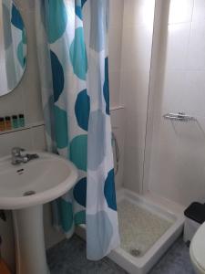 a bathroom with a sink and a shower at Anastasia Studios & Apartments in Panormos Skopelos