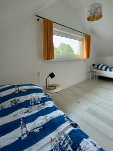 Postel nebo postele na pokoji v ubytování Chachatki Kopalino