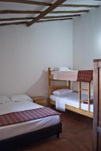 En eller flere senger på et rom på Casa Aparicio Lopez