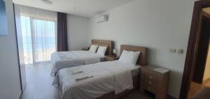 Uma cama ou camas num quarto em Hotel Svarog