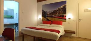 Postel nebo postele na pokoji v ubytování Le stanze del Trenino Rosso