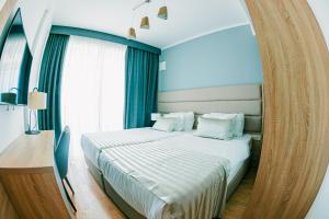 Voodi või voodid majutusasutuse Kaneo beach hotel Novalja toas