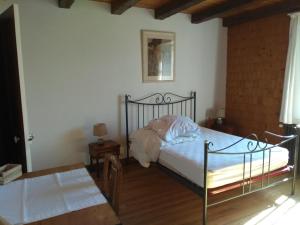 Кровать или кровати в номере Ferme du Haut Barba