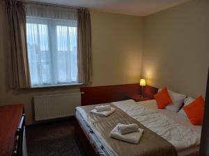 Postel nebo postele na pokoji v ubytování EndHotel Bielany Wroclawskie