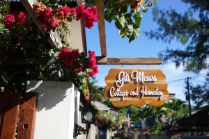 a sign for the entrance to a disney resort at Gili Mesari Cottages & Homestay in Gili Trawangan