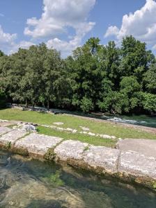 a river with trees in the background at Villa Longina in Ljubuški