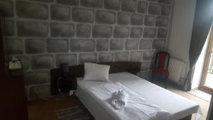 Postel nebo postele na pokoji v ubytování Hotel Camelot