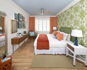 a hotel room with a bed and a desk at Circa 39 Hotel Miami Beach in Miami Beach